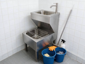 Space-saving dual-tier commercial mop sink and hand wash station combo, serving as a multi-purpose stainless janitorial wash sink