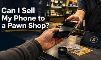 Person selling an old phone at a pawn shop
